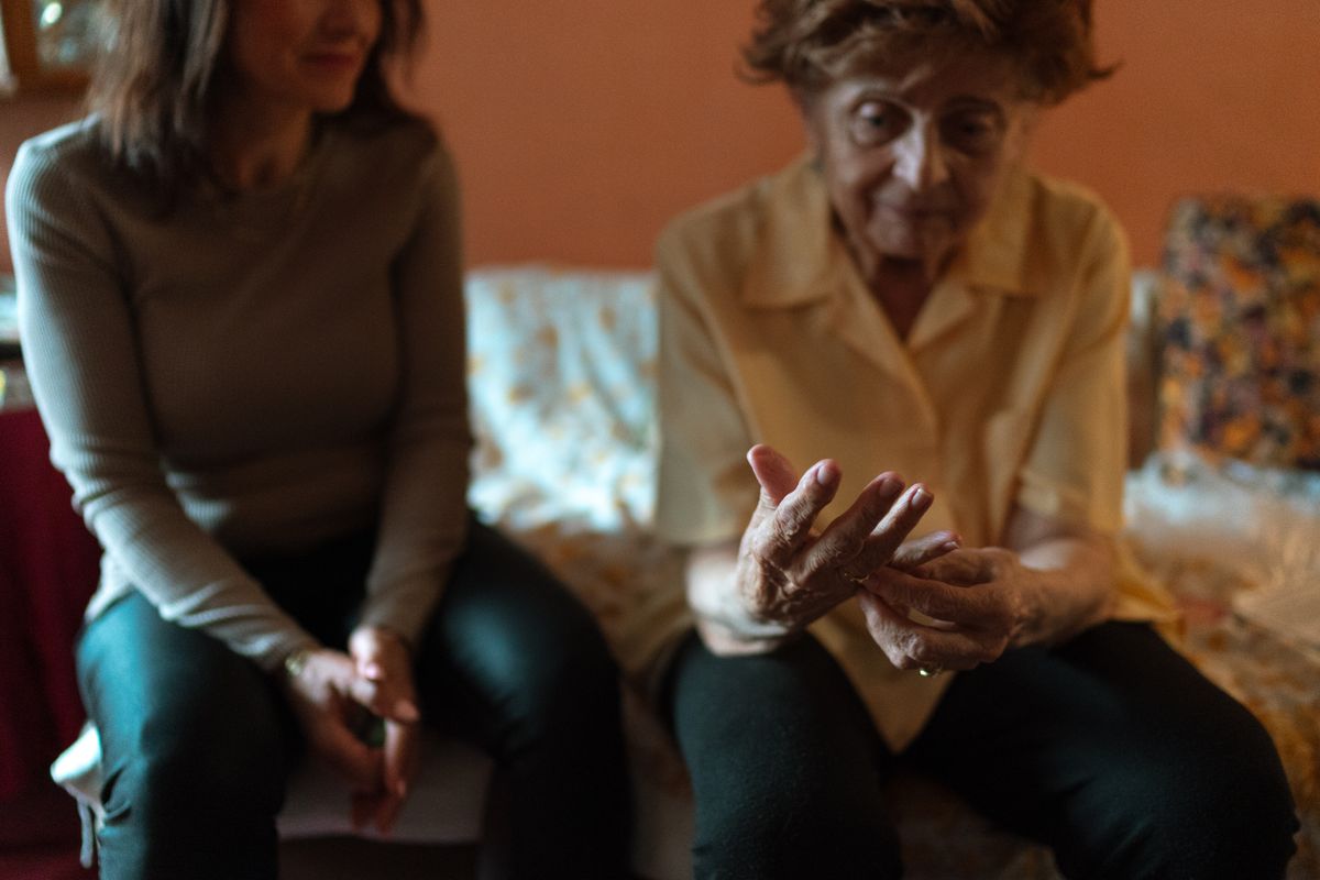 A caregiver and client talking together